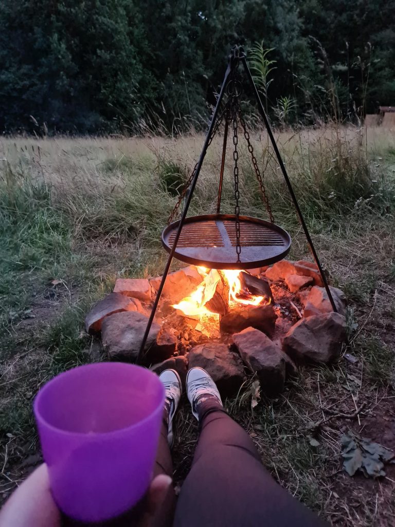 A roaring camp fire, with a glass of red wine in the foreground (well, a child's plastic cup of wine!)