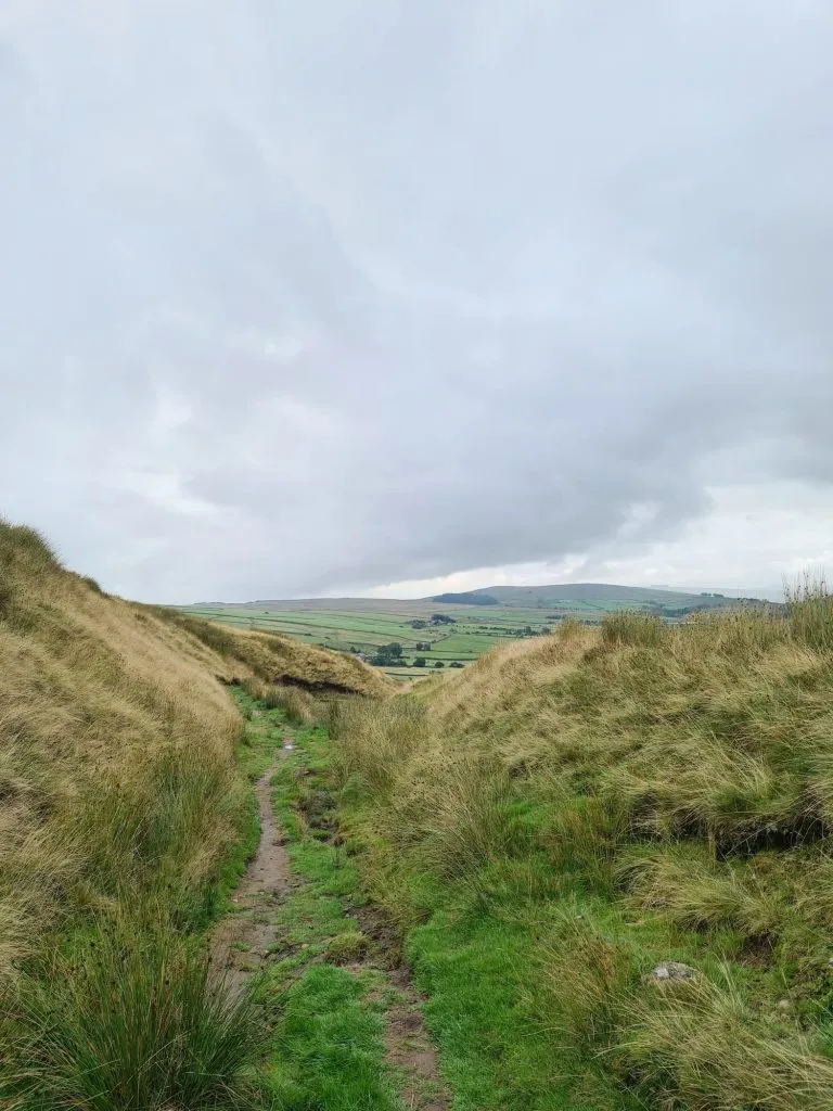 A dirt track leading up Pendle Hill