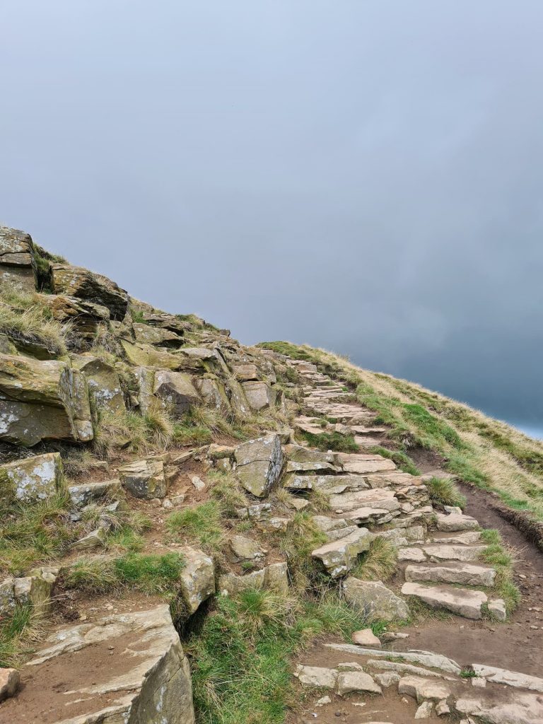 A rough stone path leading down Pendle Hill