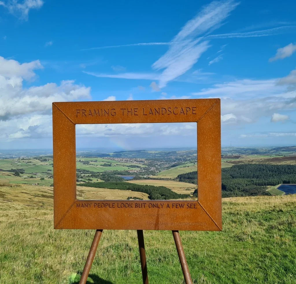 View from Holme Moss framed in a rust coloured picture frame - The Wandering Wildflower