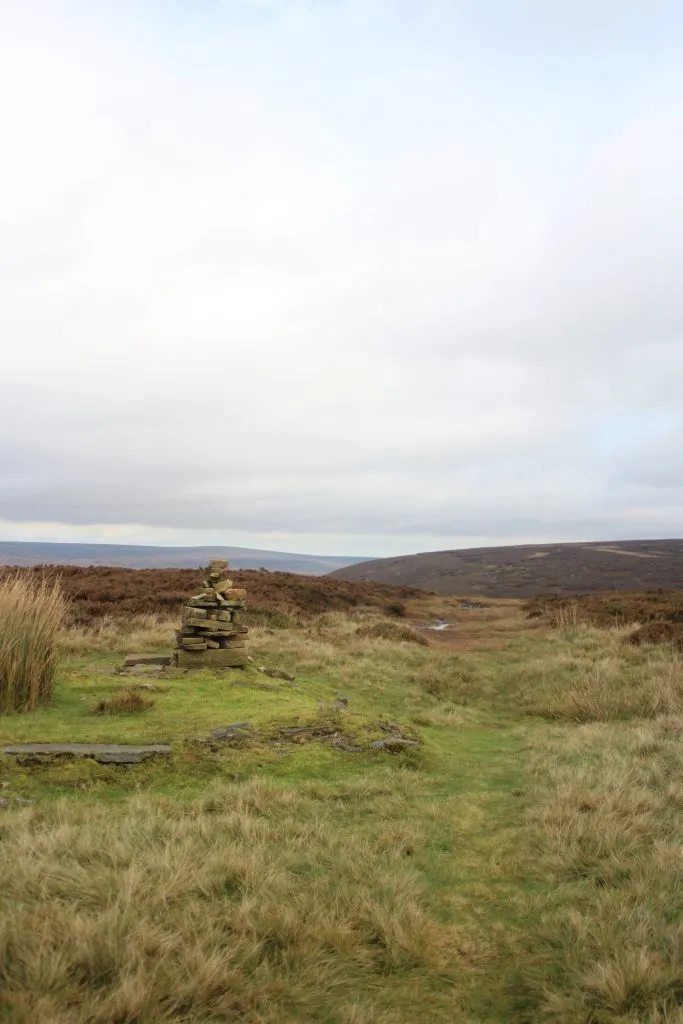 Cairn near the foundations of a building on the top of Cock Hill