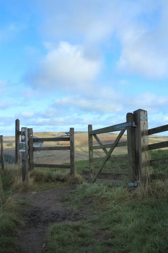 Stile and gate at the top of the path with views down towards Errwood Reservoir