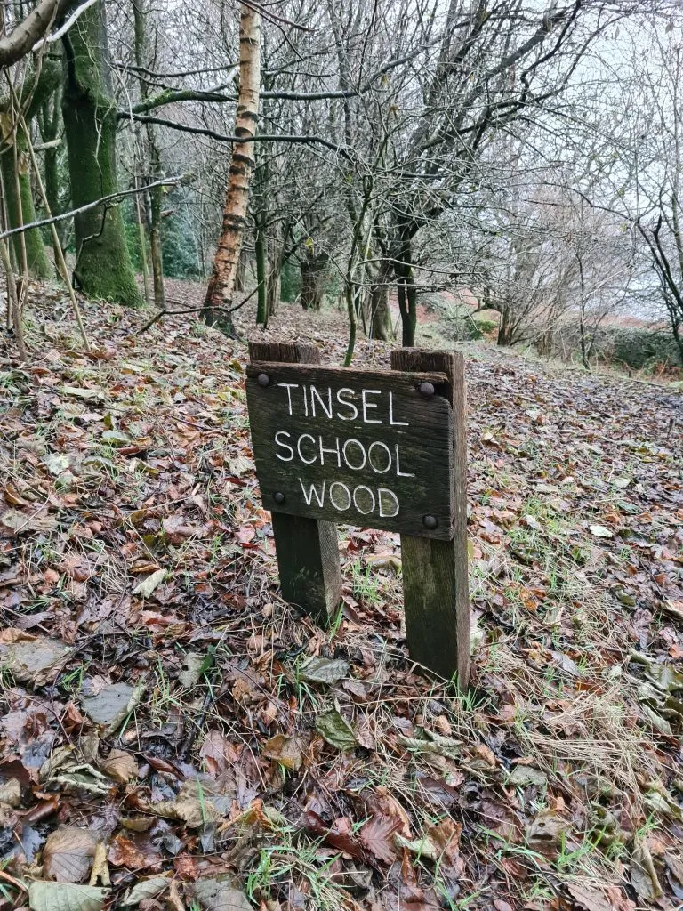 Tinsel School Wood signpost
