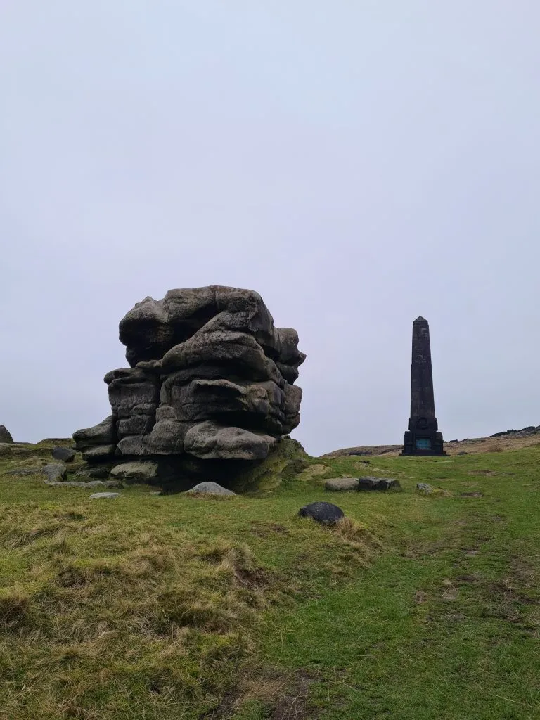Pots and Pans Stone and the war memorial on the hill top