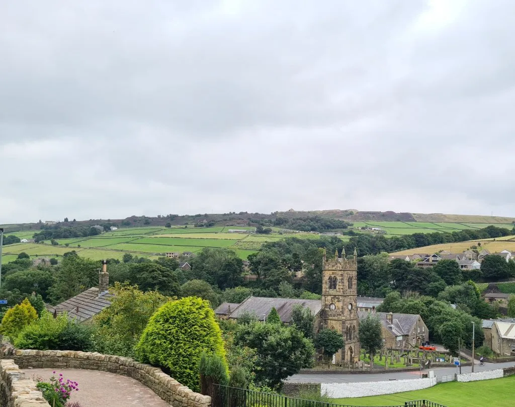 Views of Holmbridge Church with countryside beyond