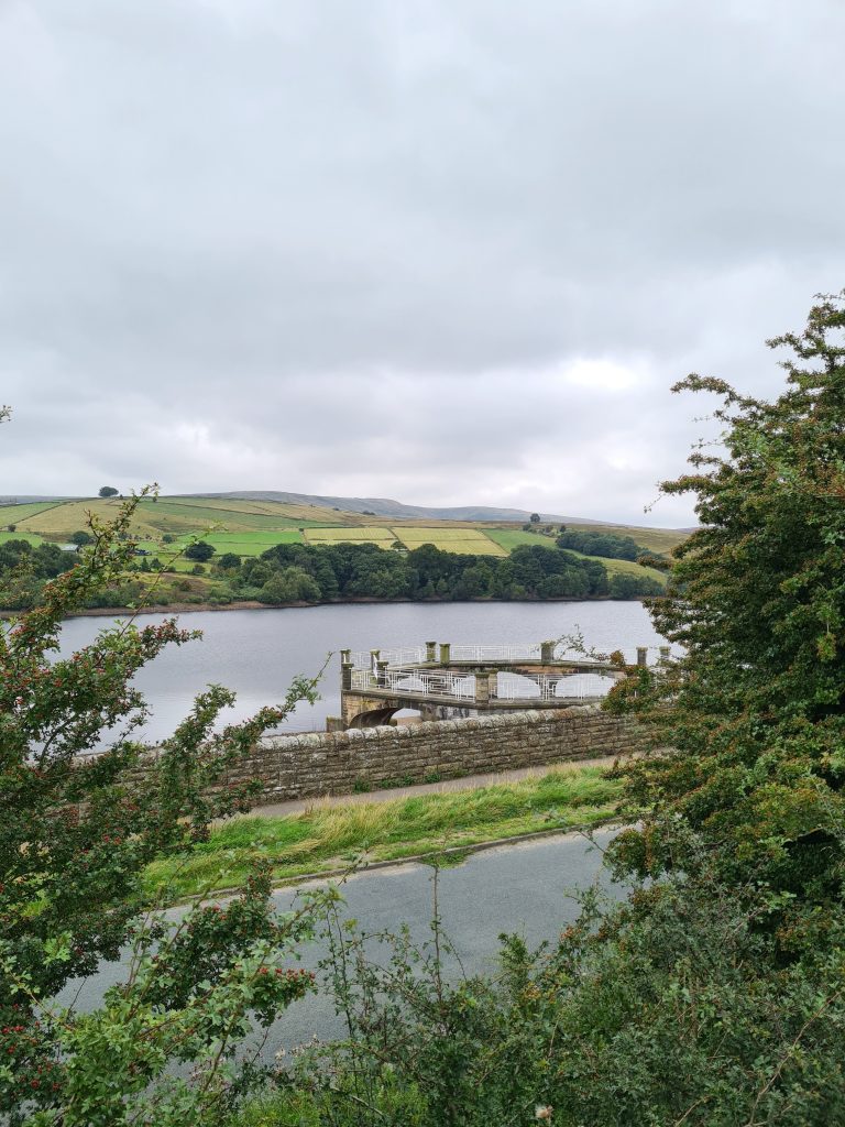 Digley Reservoir overflow with views to Holme Moss