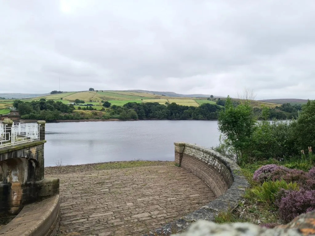 Digley Reservoir overflow with views to Holme Moss