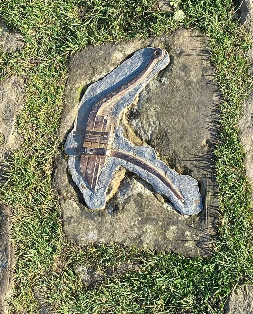 Hill fort carvings at Mam Tor showing an Iron Age tool, possibly a plough