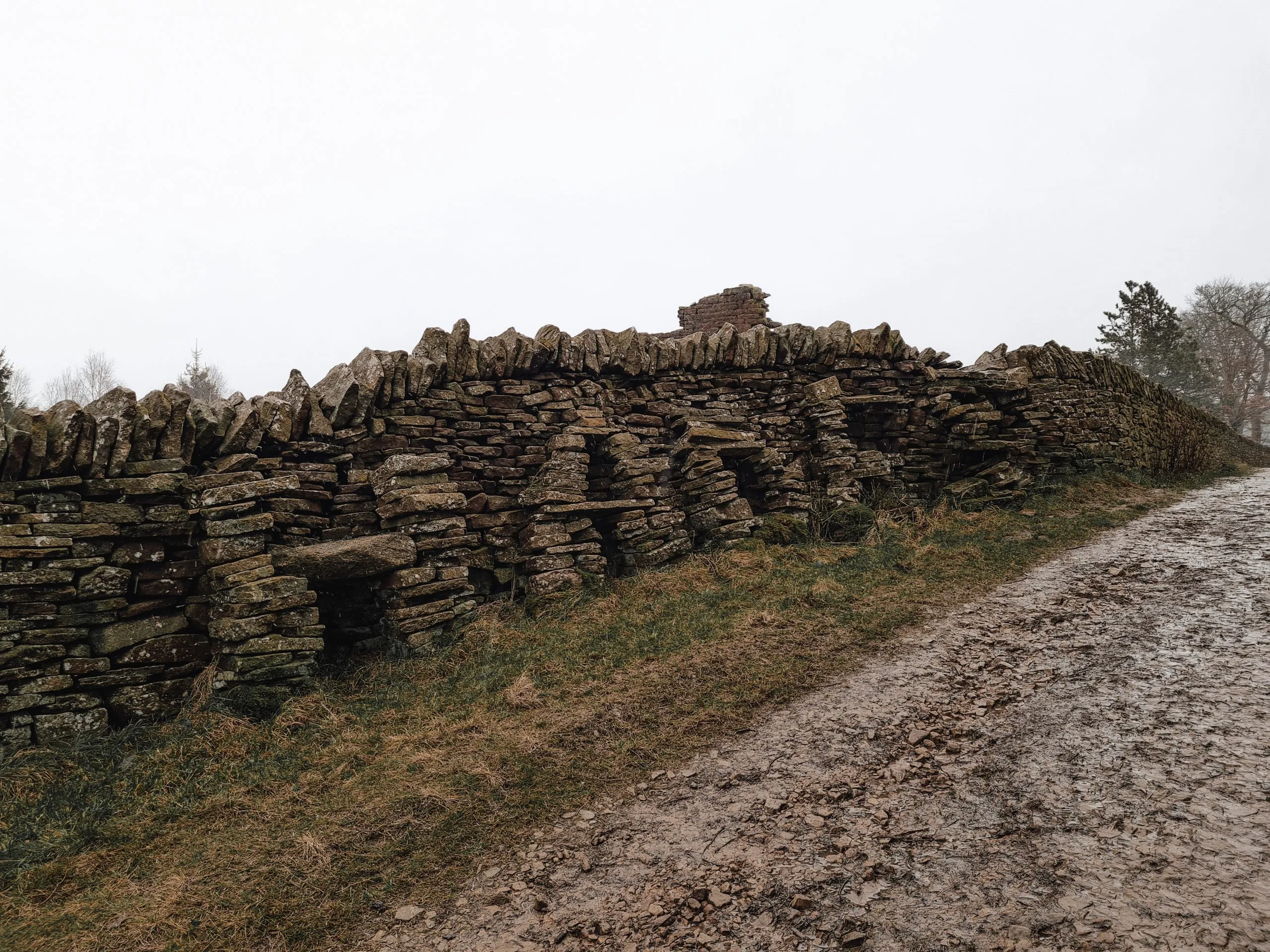 Wall with the word Hades made from stone Ruins of the former farm at Hades - Hades Circular Walk in Holmfirth by The Wandering Wildflower