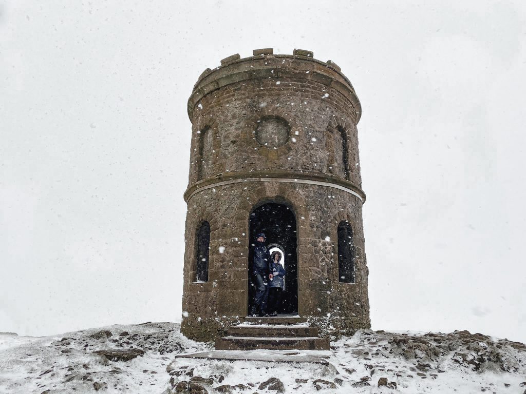 A small tower in the snow at Grin Low, Solomon's Temple near Buxton
