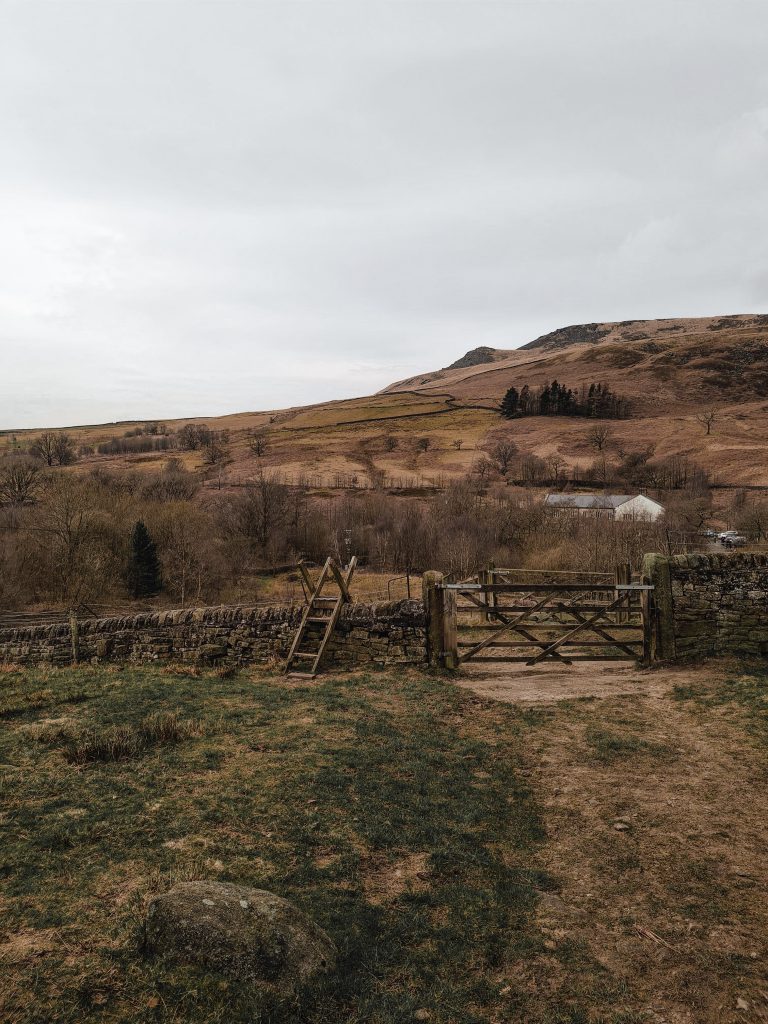 A view over a stile and gate in Crowden