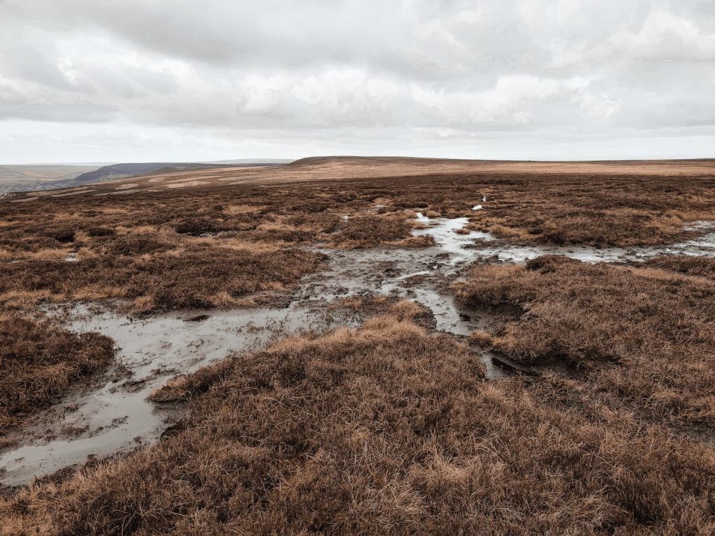 A bleak, boggy and featureless moorland near Margery Hill