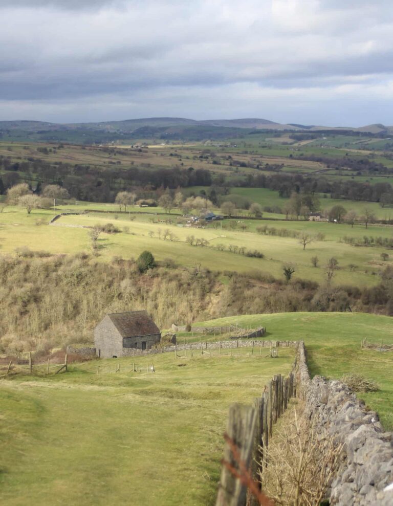 View down a field to an old engine house
