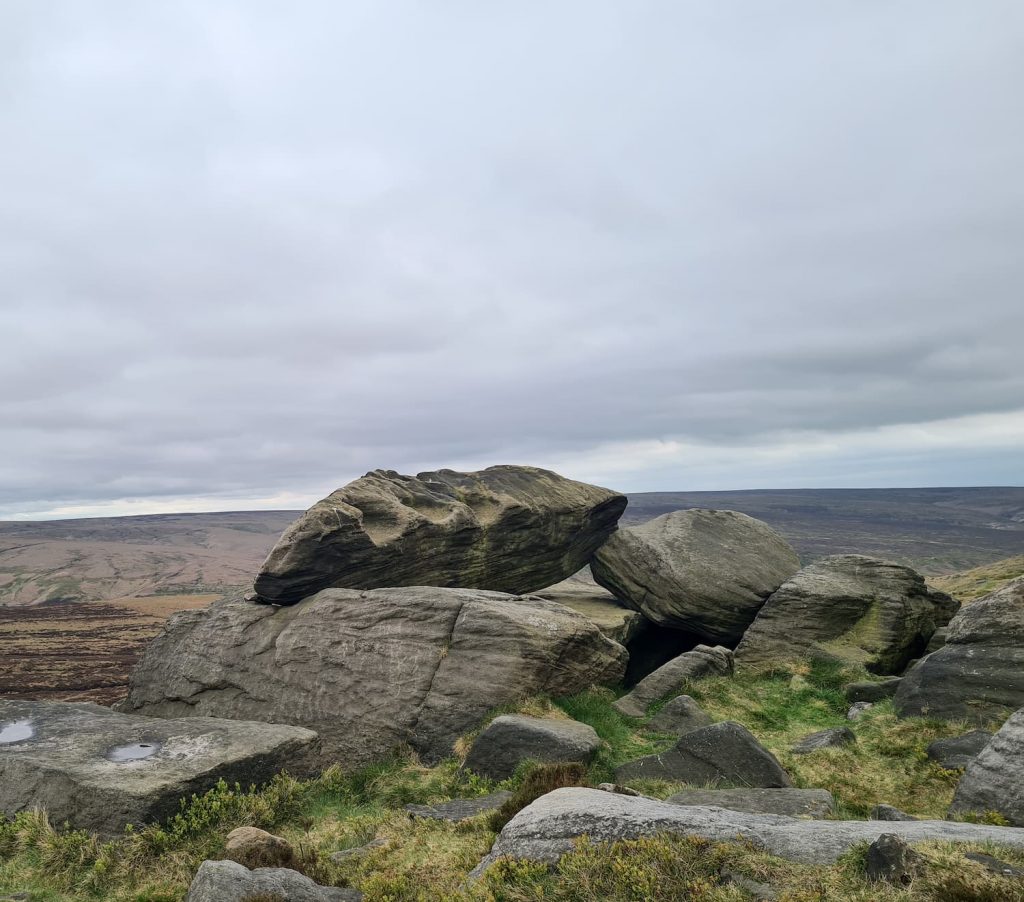 The Druid's Stone at West Nab, a large gritstone boulder with three hollows