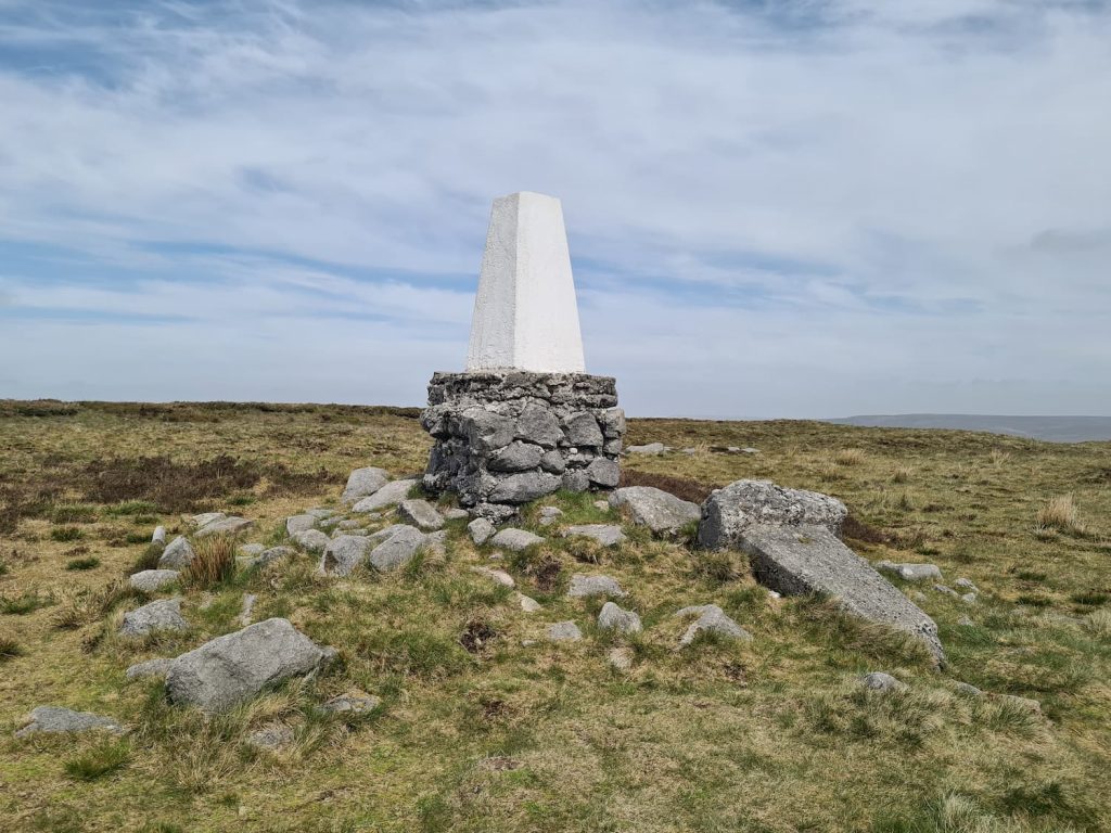 The Edge trig point with the fallen original trig point on the ground next to it