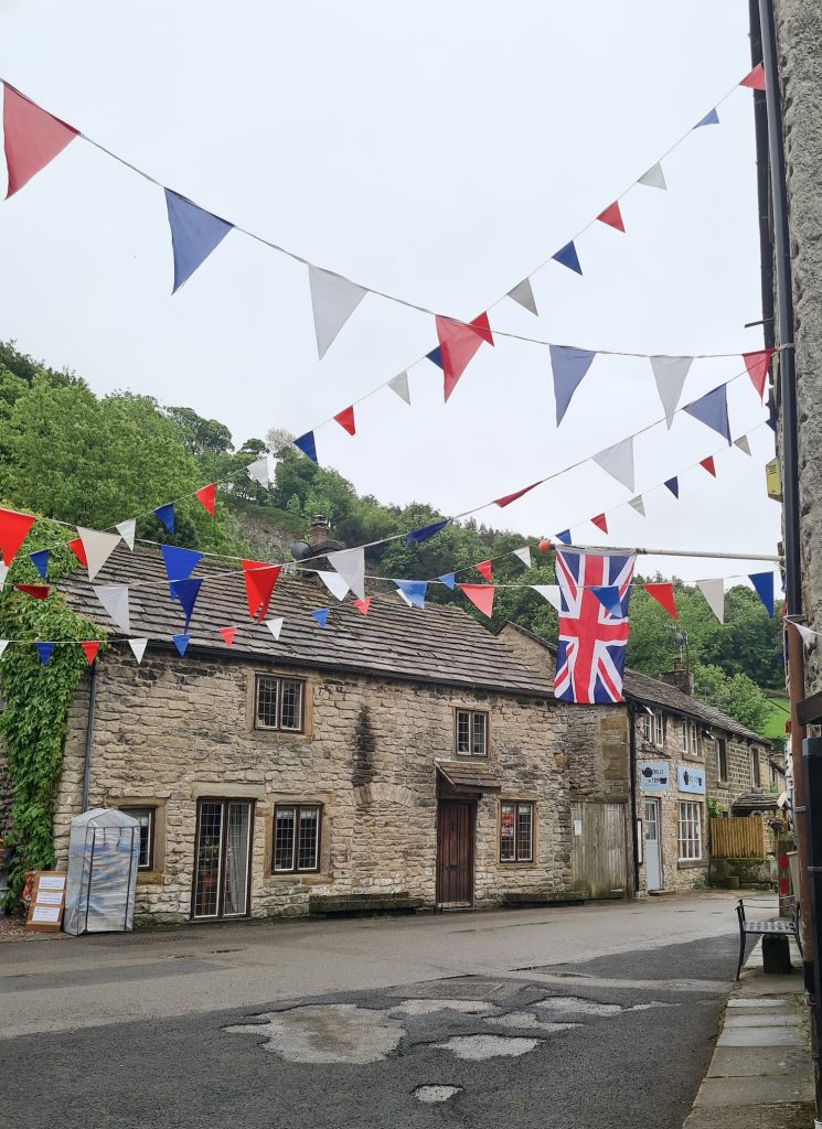 The pretty village of Castleton with red, white and blue bunting up for the Queen's Jubilee