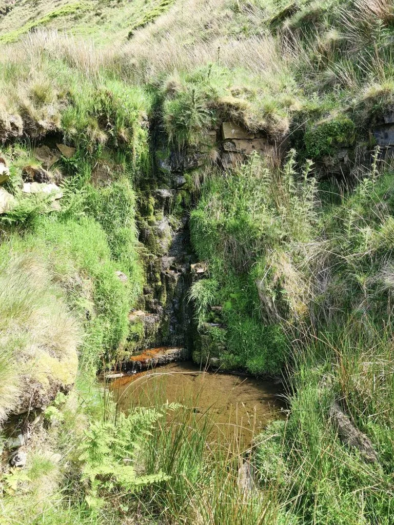 A small moorland waterfall with plunge pool