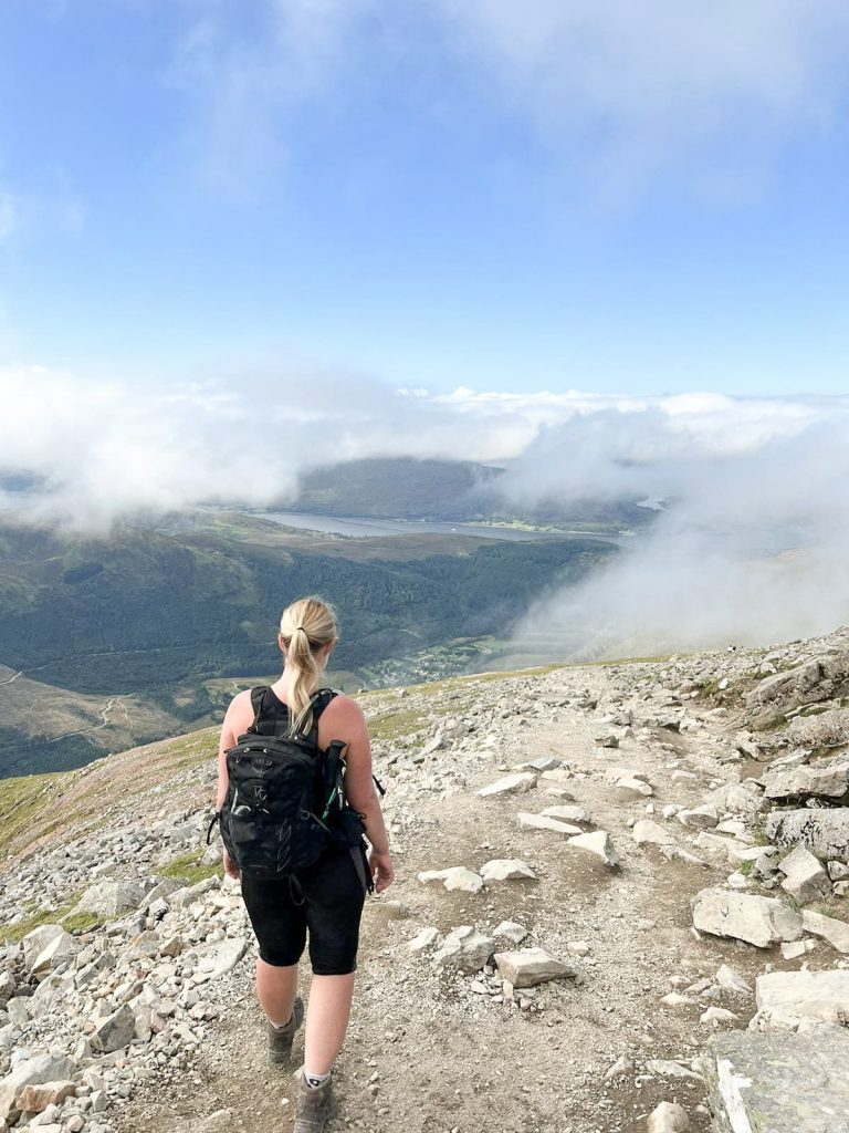 A woman near the summit of Ben Nevis - Ben Nevis Route from The Wandering Wildflower