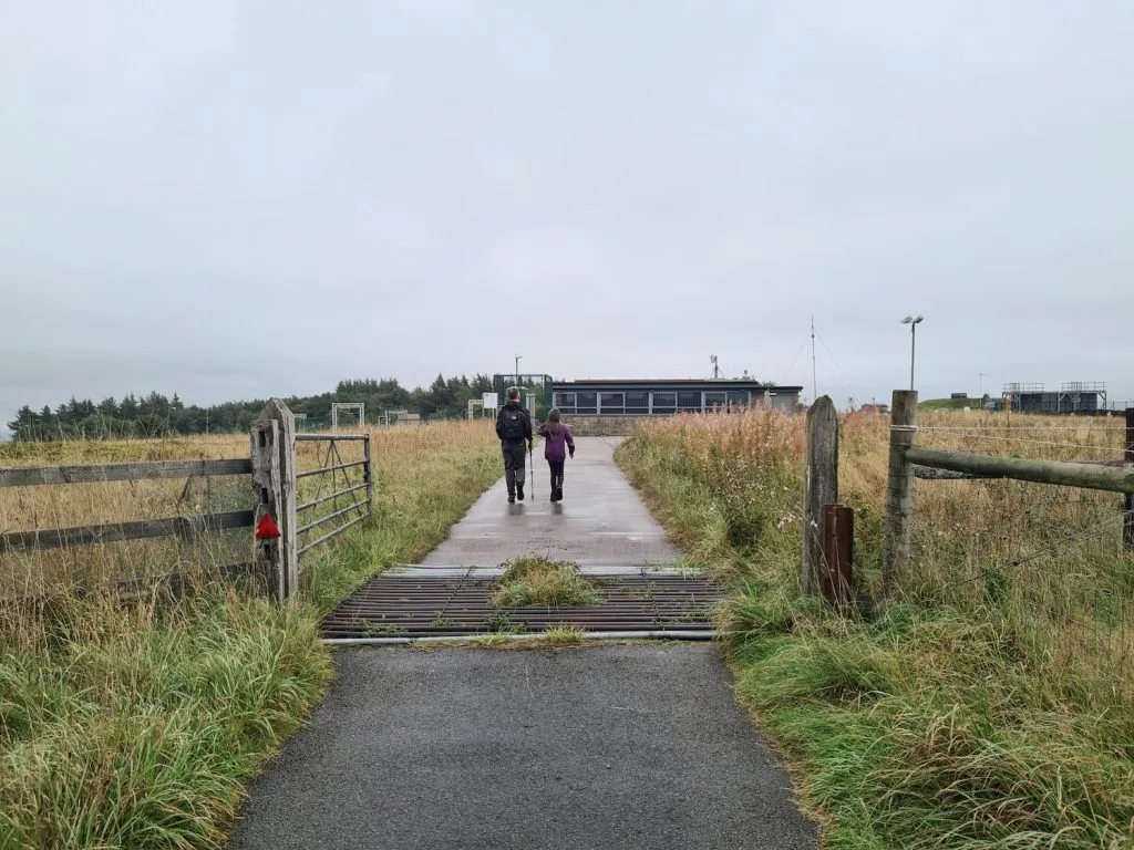 A man and girl walking along a path - The Wandering Wildflower