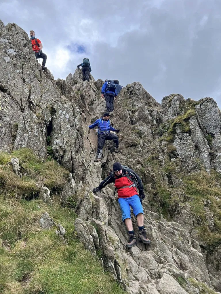 People climbing down Striding Edge - The Wandering Wildflower