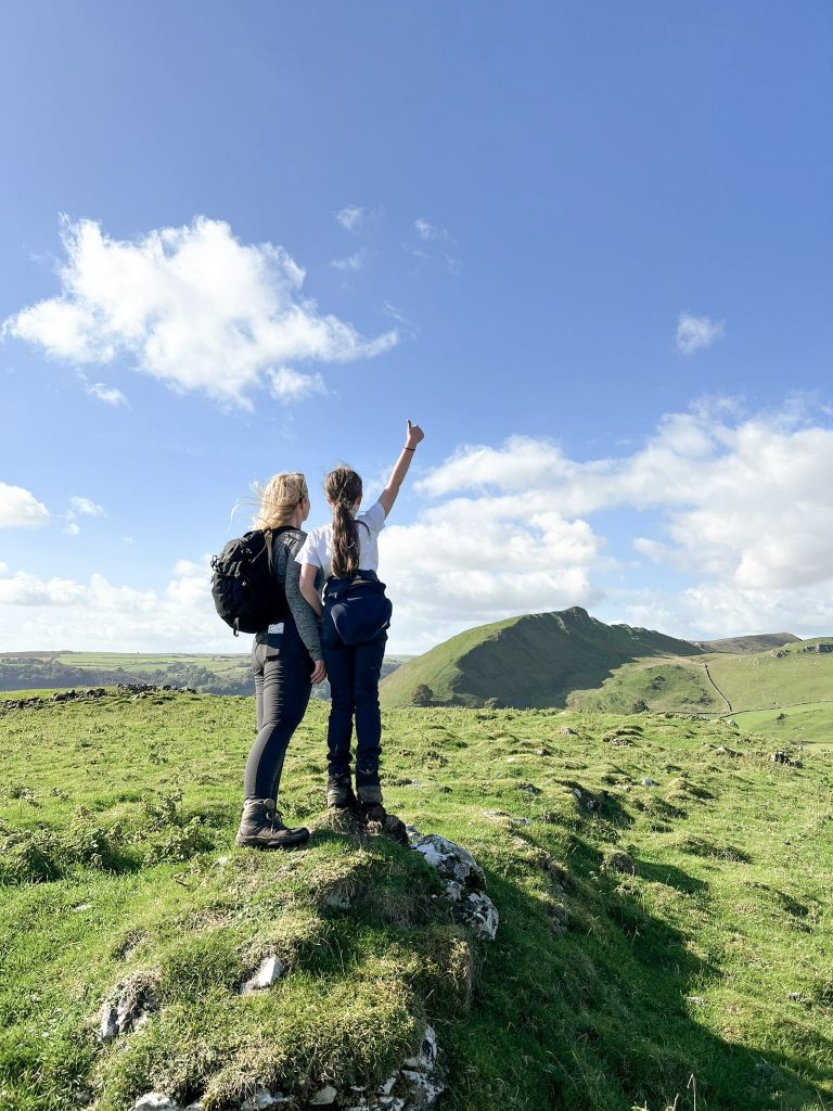 A mother and daughter with a view of Chrome Hill