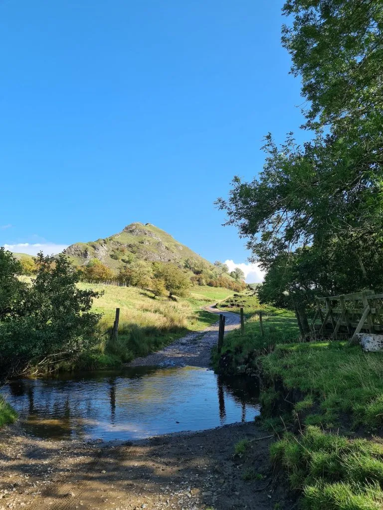 Parkhouse Hill with a river in the foreground - The Wandering Wildflower