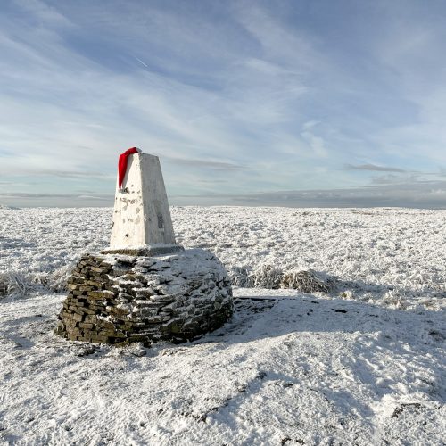 Black Hill trig point in a Santa hat - Best Boxing Day walks in the Peak District by The Wandering Wildflower