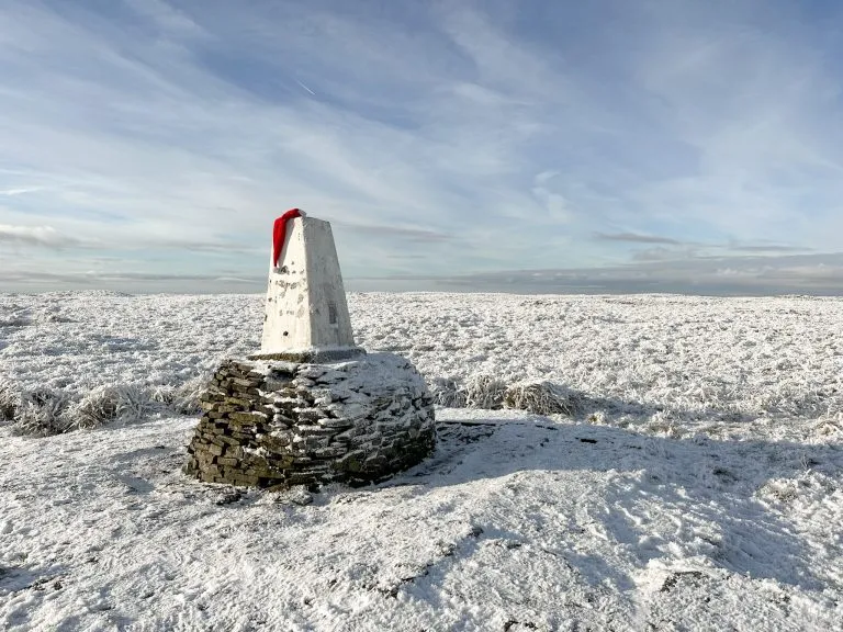 Black Hill trig point in a Santa hat - Best Boxing Day walks in the Peak District by The Wandering Wildflower