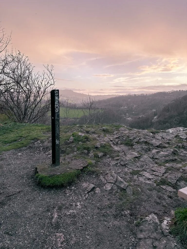 The summit of High Tor with a sunset starting in the background