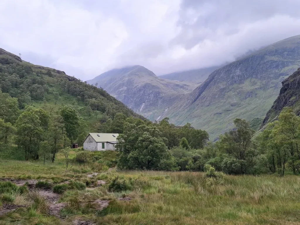 A small white mountain cabin in Glen Nevis