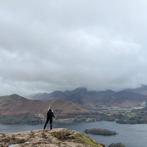 A woman admiring the view over Derwentwater from Walla Crag