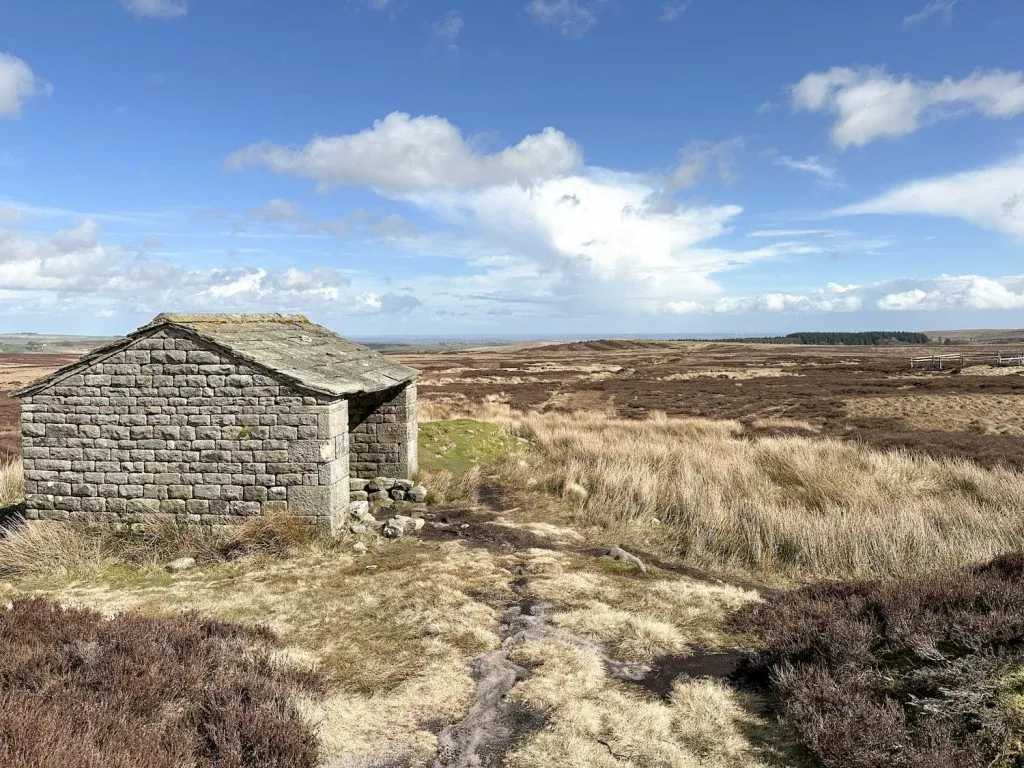 A small stone shelter on Stanage Moor