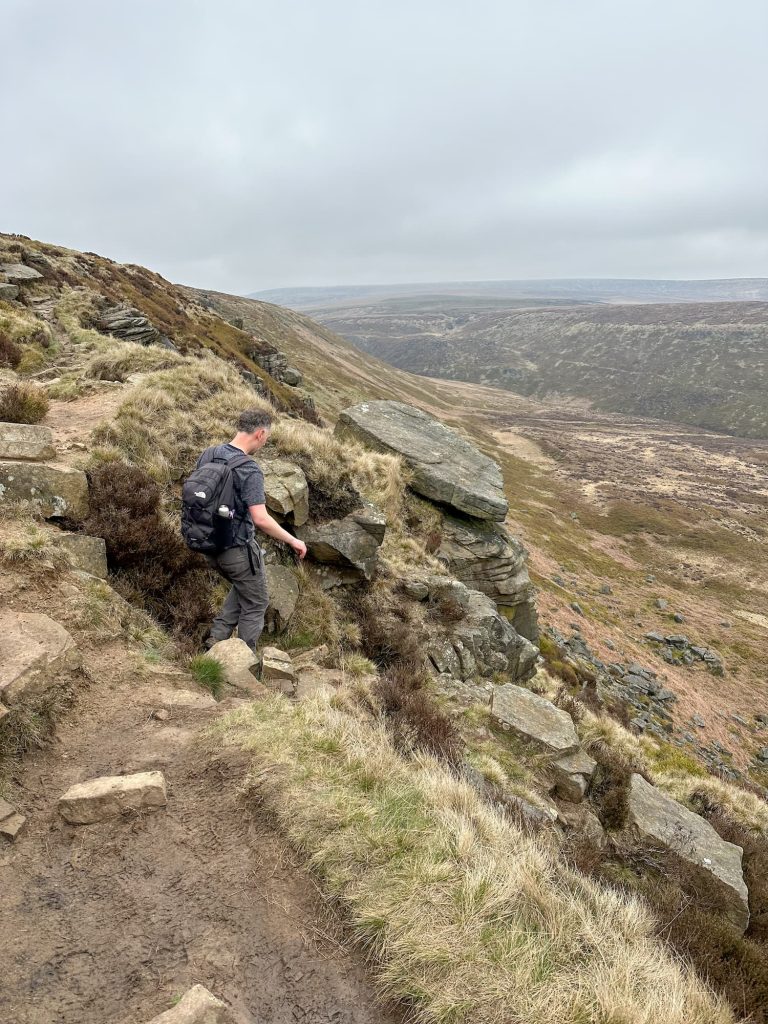 A man hiking on the moors
