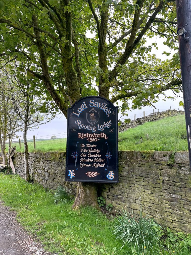 A sign for Rishworth Hunting Ldge
