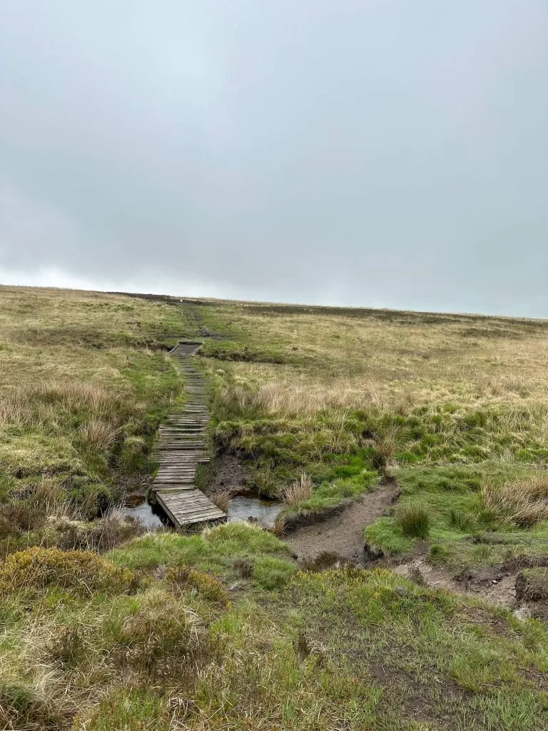 A wooden pallet bridge crossing a bog on the moors.