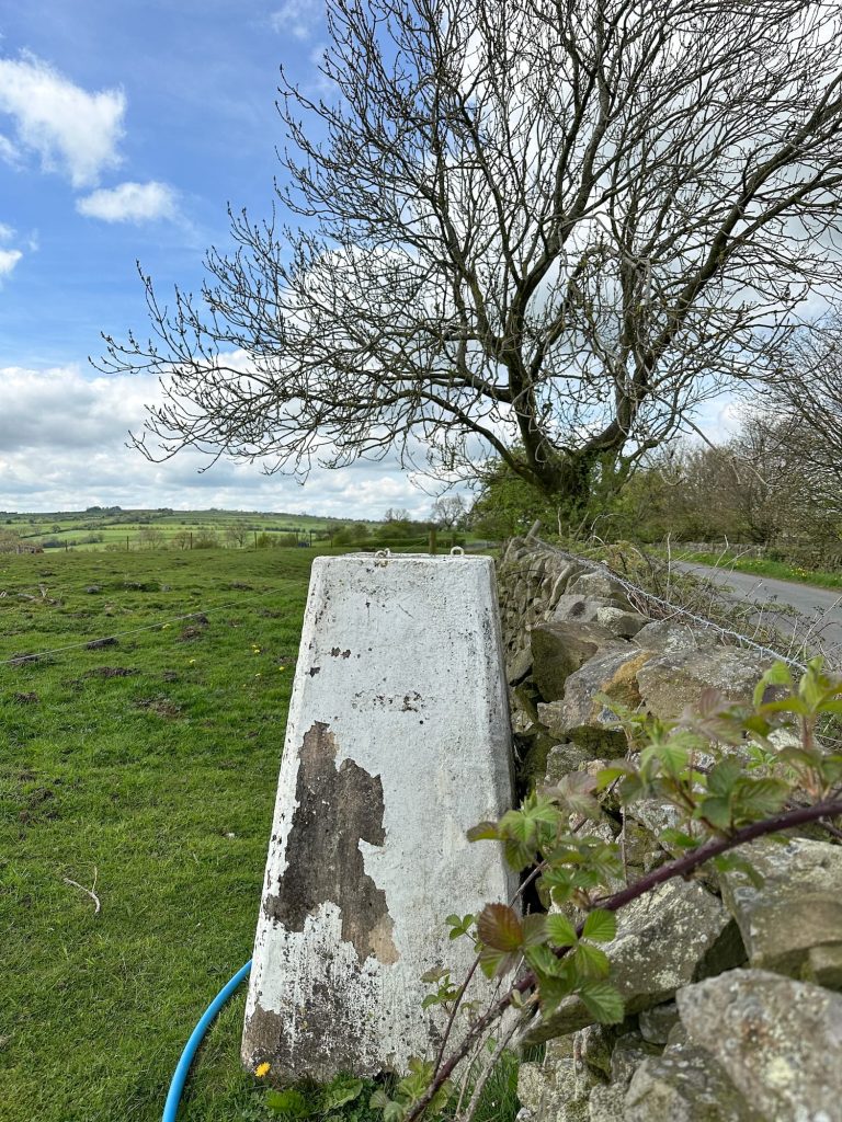 Martins Low trig point, a concrete pillar with peeling white paint