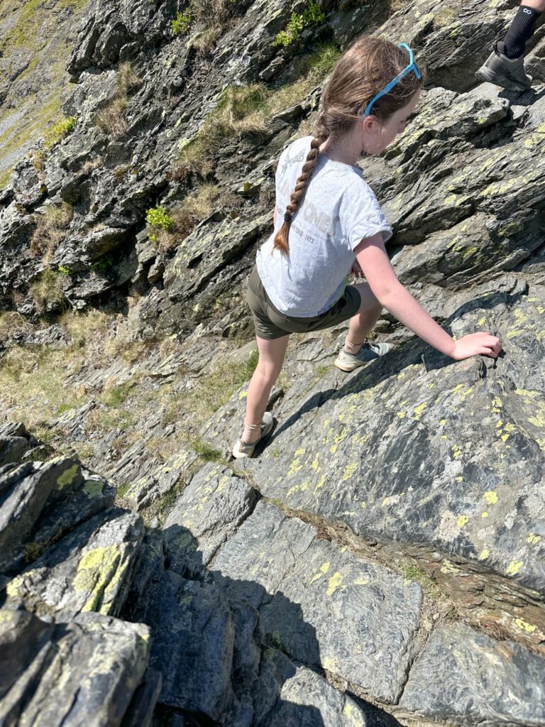 A young girl crossing Sharp Edge. 