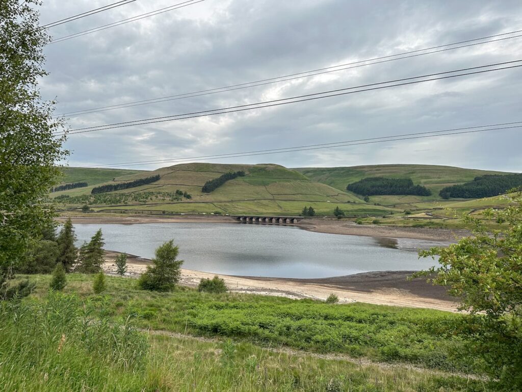 A view over the reservoir, with the moorland in the background