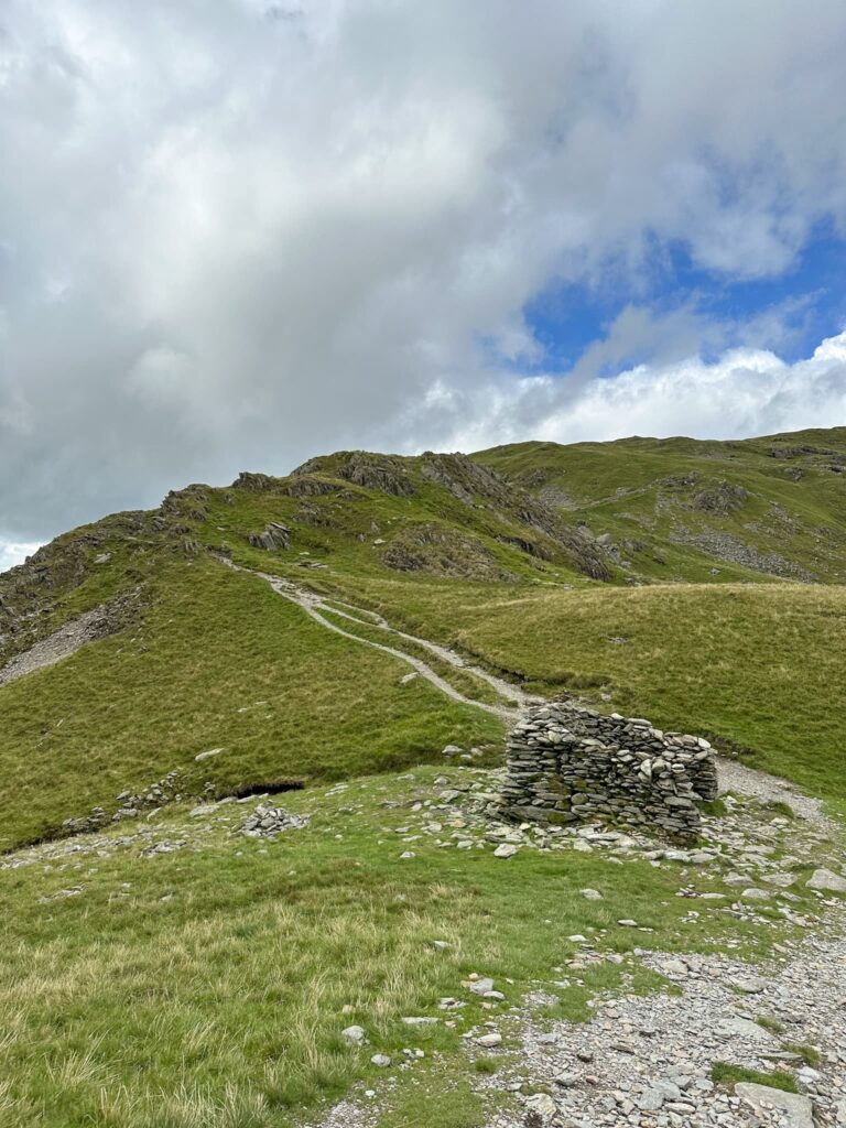 A small stone shelter at the top of Nan Bield Pass