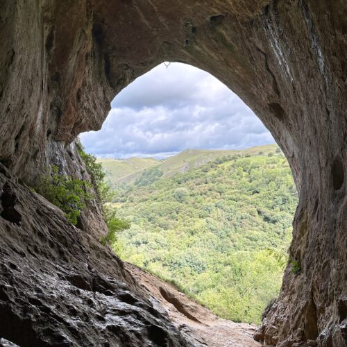 A view from inside Thor's Cave looking out across the valley