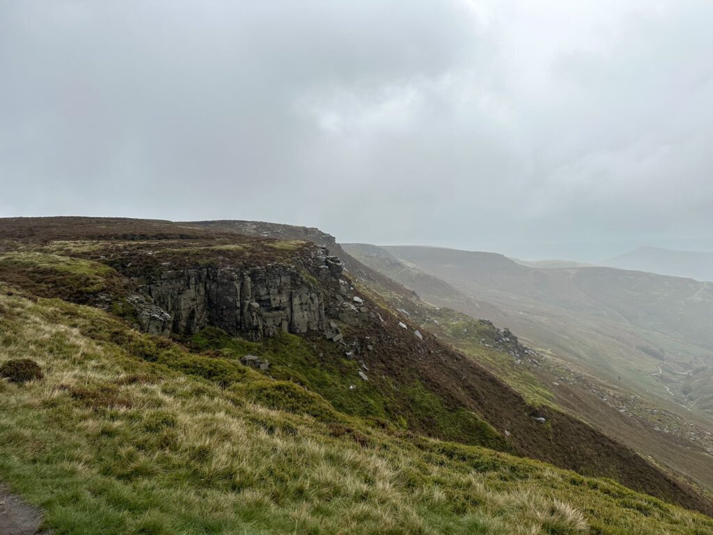 A view of Nether Tor from Upper Tor, shrouded in mist