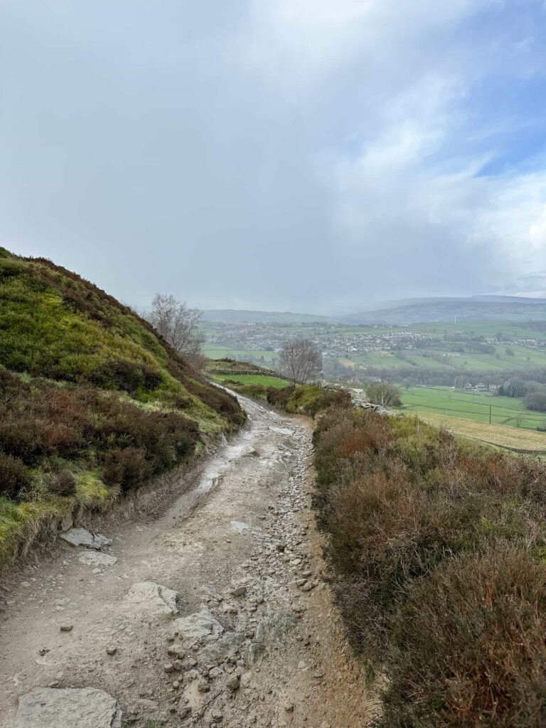 A rough stony track leading down from the moors