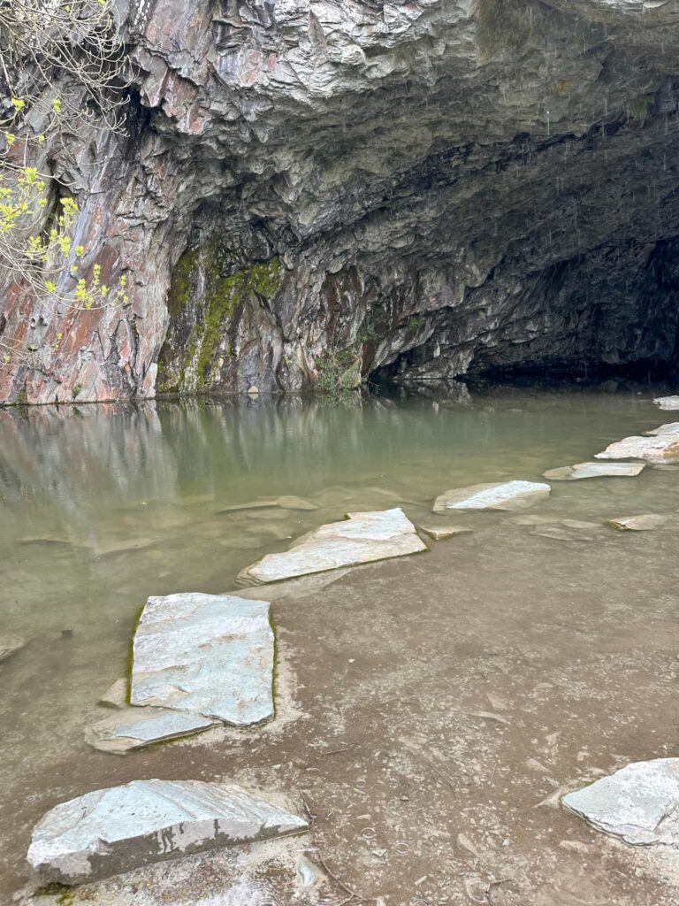 Stepping stones leading into a cave