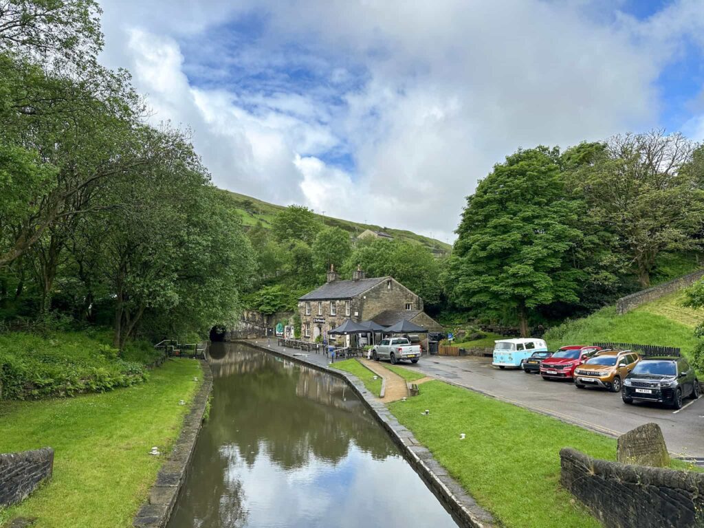 Standedge Tunnel visitors centre with the canal in the foreground