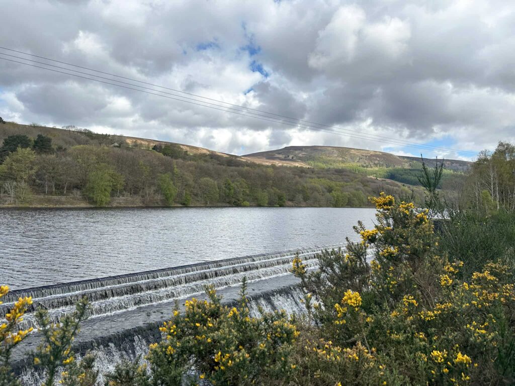 A view across Valehouse Reservoir with Crowden in the background