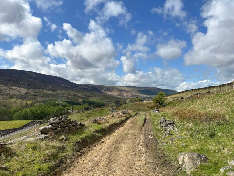 A dirt track leading to the Torside Reservoirs walk