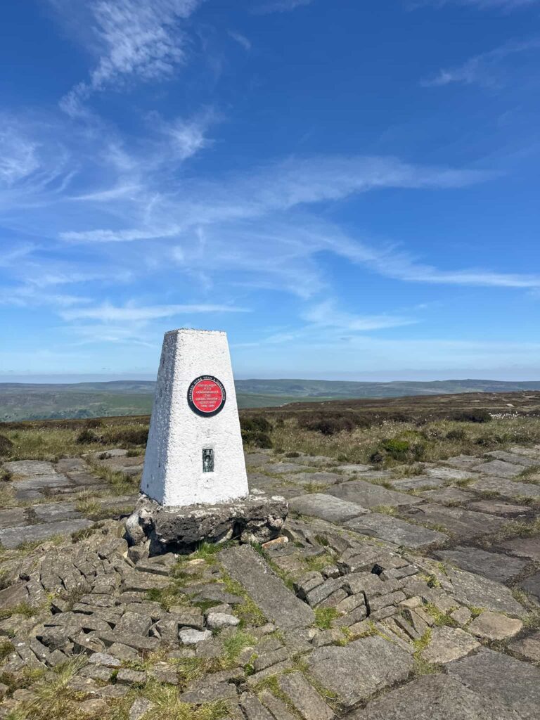 Edale Moor trig point on a sunny day