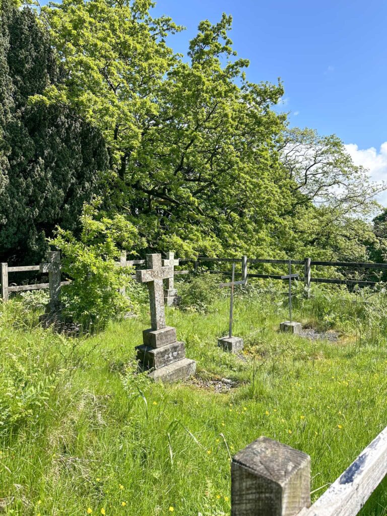 A stone cross marking the graves of the Grimshawe family