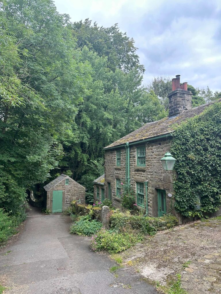 An old cottage in Edale with green painted windows