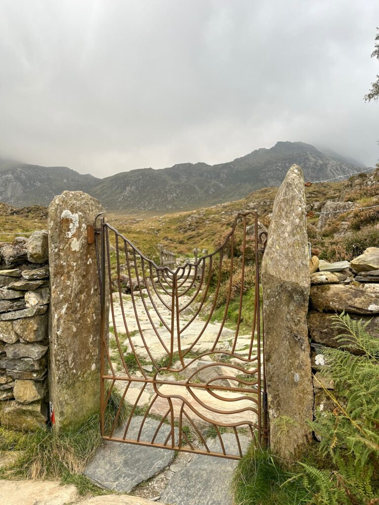 An ornate metal gate into the Cwm Idwal Nature Reserve